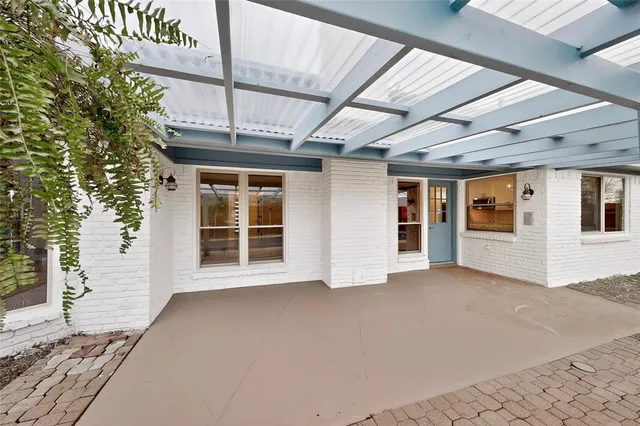 a front view of a house with swimming pool