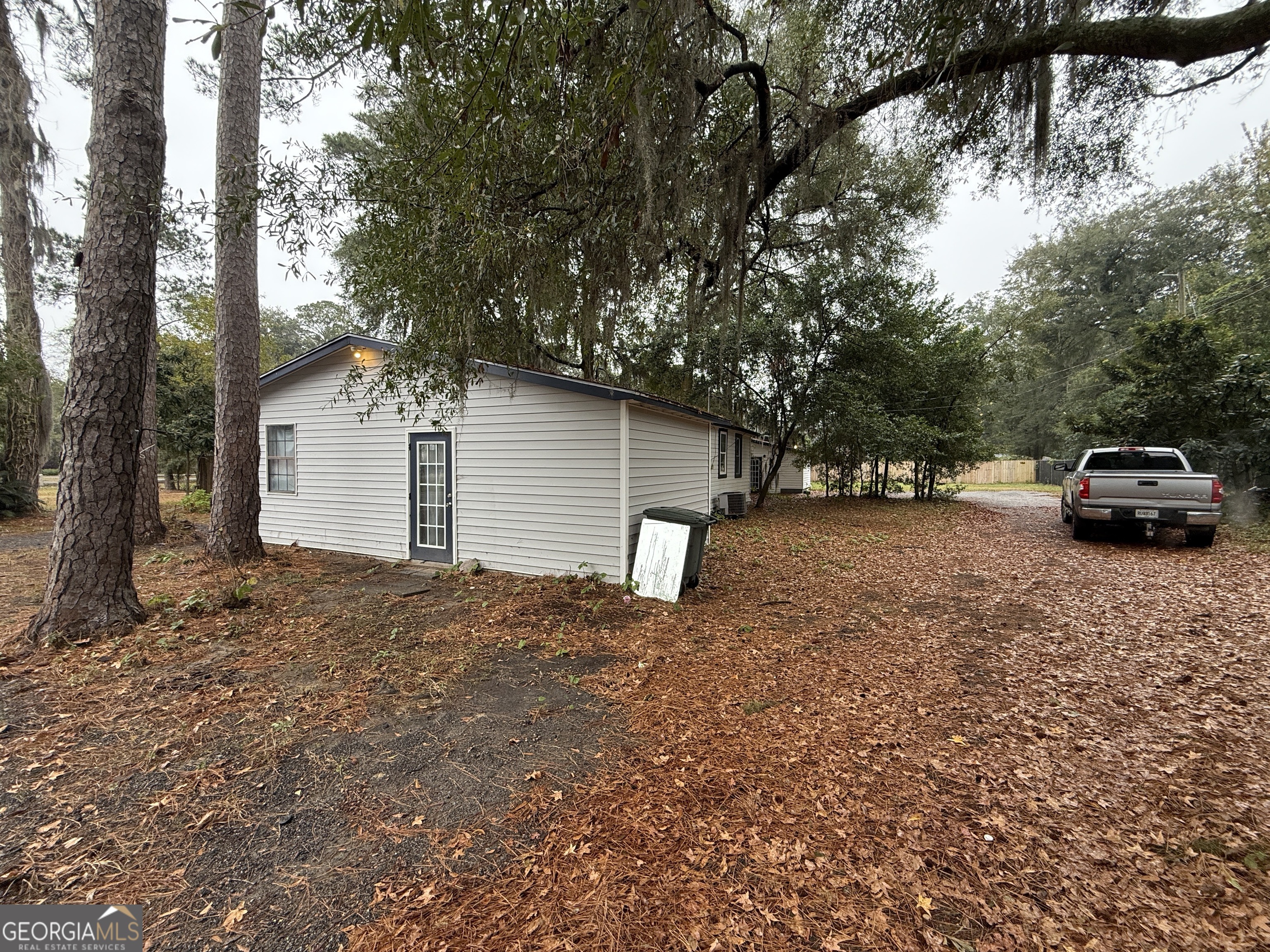 316 Edgewater Road Savannah, GA 31406 - Photo 2 of 13 a car parked in front of white house