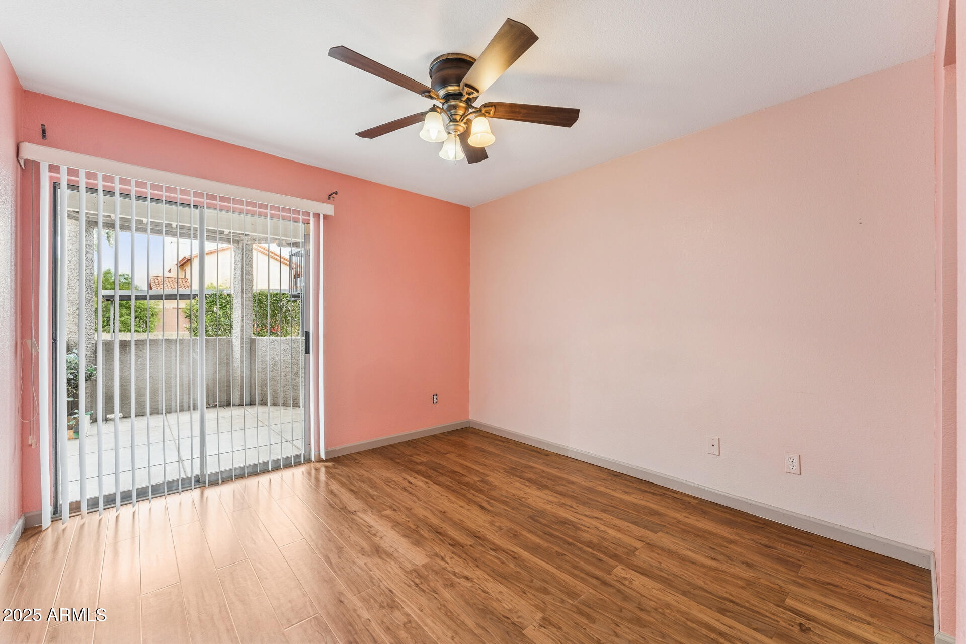 1720 East Thunderbird Road, Unit 1070 Phoenix, AZ 85022 - Photo 11 of 19 an empty room with wooden floor and windows