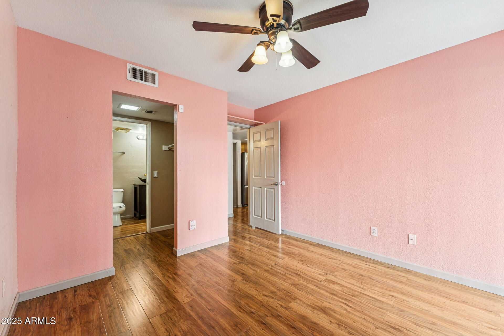 1720 East Thunderbird Road, Unit 1070 Phoenix, AZ 85022 - Photo 13 of 19 wooden floor in an empty room with a window