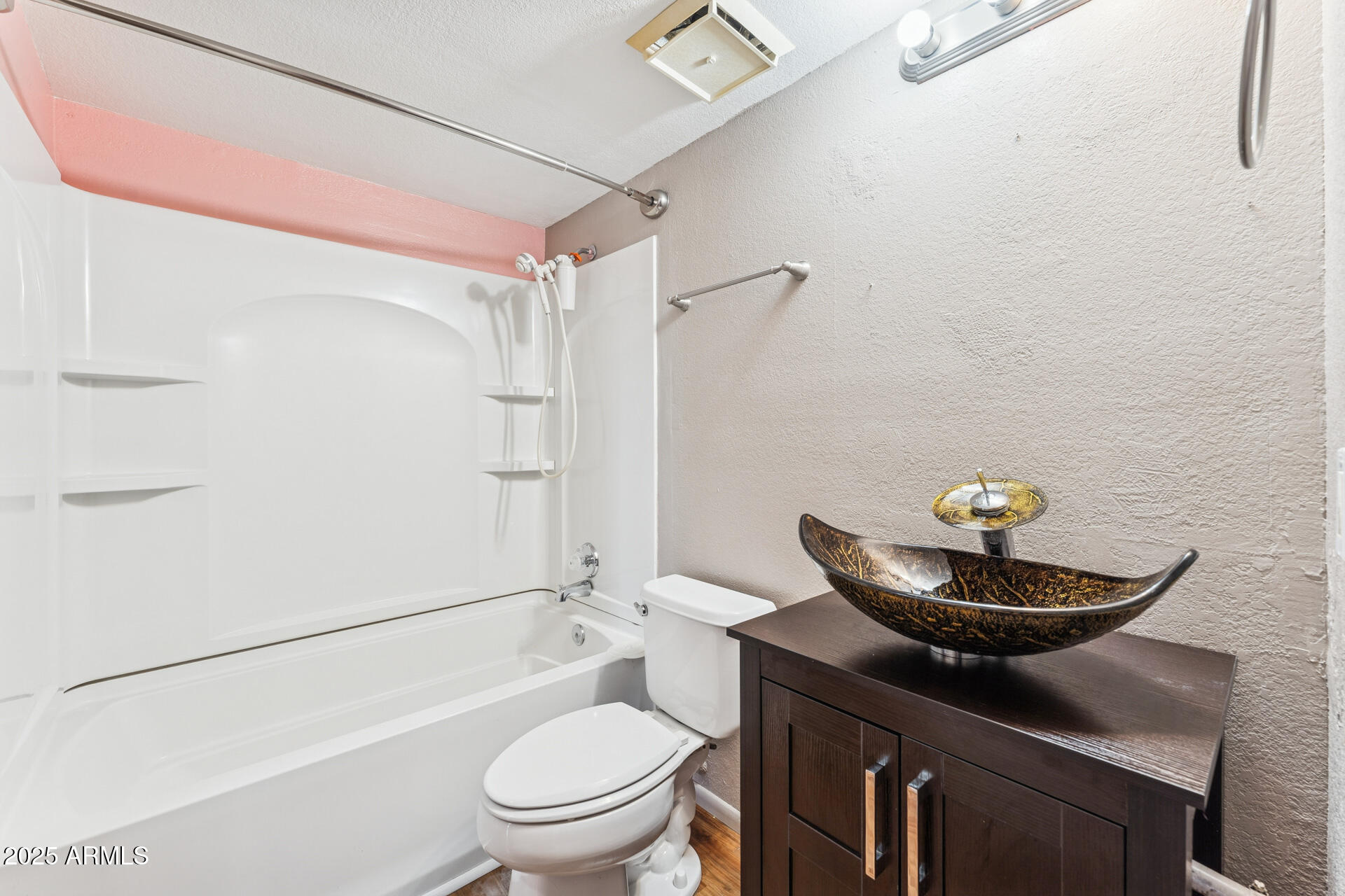 1720 East Thunderbird Road, Unit 1070 Phoenix, AZ 85022 - Photo 14 of 19 a bathroom with a sink a toilet and shower