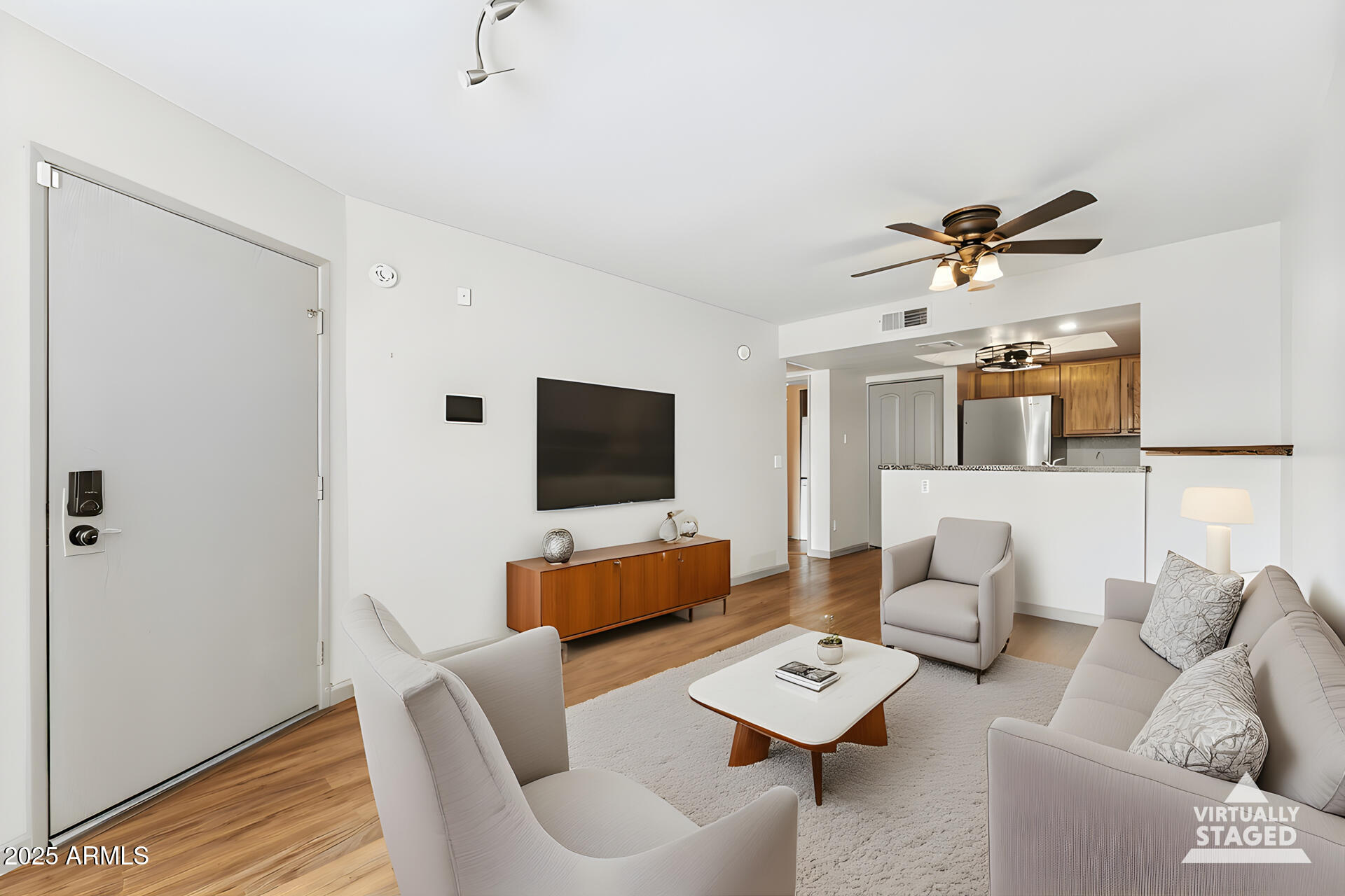 1720 East Thunderbird Road, Unit 1070 Phoenix, AZ 85022 - Photo 5 of 19 a living room with furniture and a flat screen tv