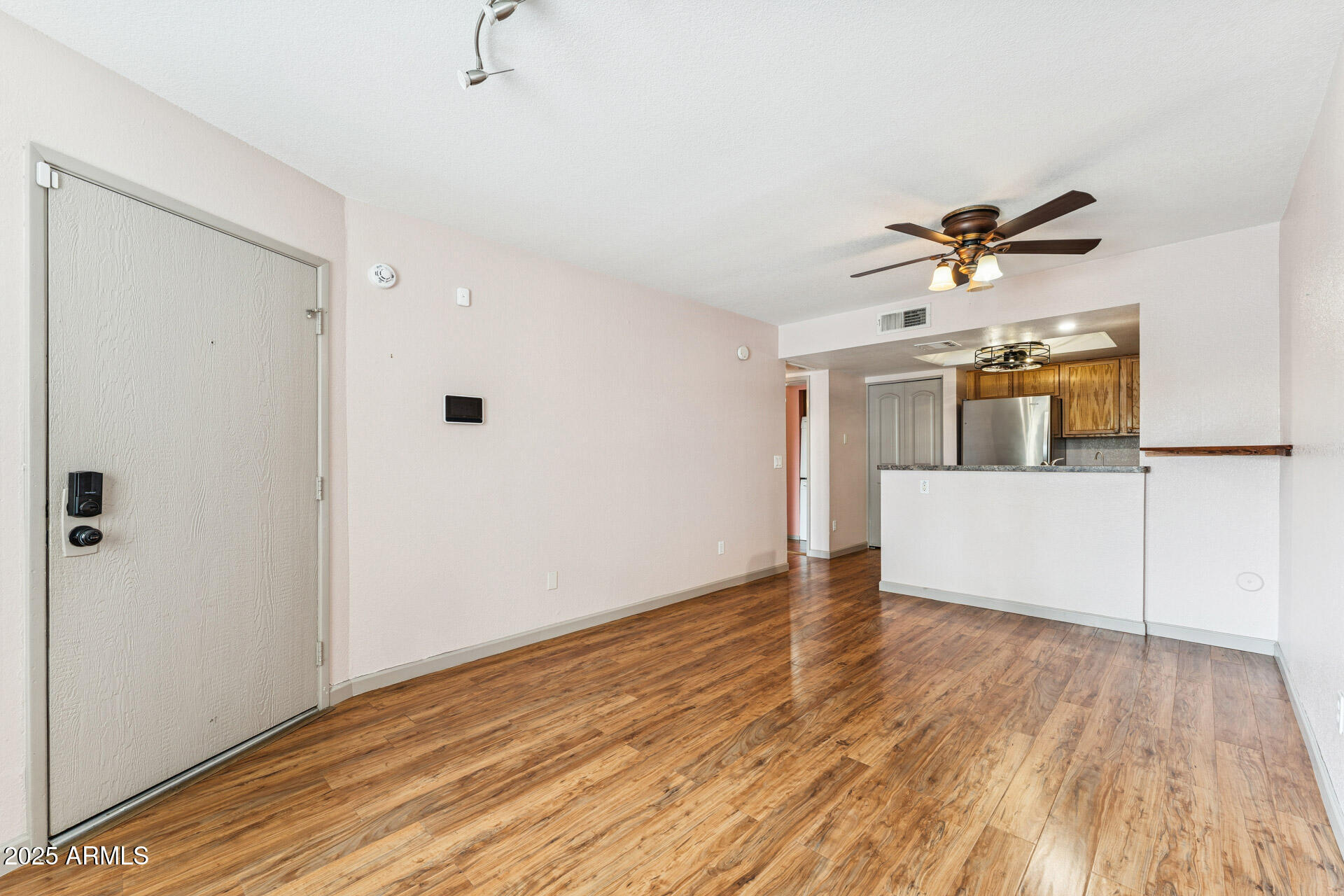 1720 East Thunderbird Road, Unit 1070 Phoenix, AZ 85022 - Photo 6 of 19 a view of a room with a wooden floor