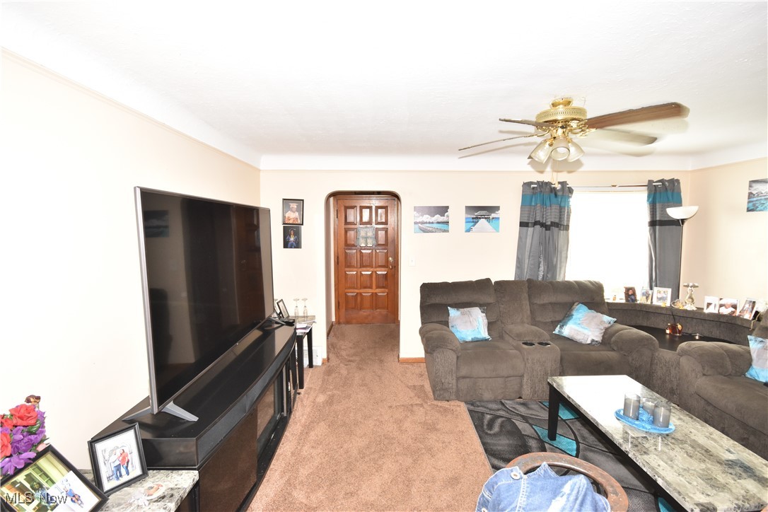 5840 Turney Road Cleveland, OH 44125 - Photo 5 of 21 Carpeted living room featuring ceiling fan