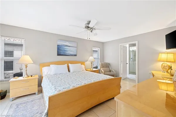 a bedroom with a bed and couch