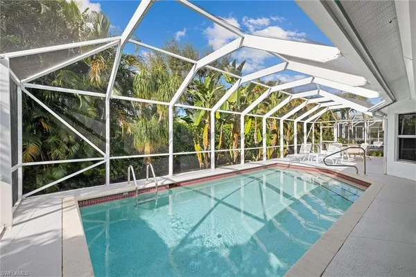 a view of a swimming pool with a porch