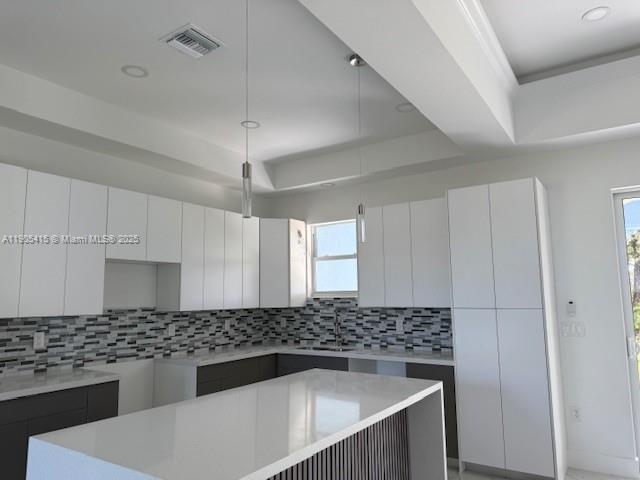 617 Valley Avenue Lehigh Acres, FL 33974 - Photo 11 of 46 a kitchen with granite countertop a sink and a stove top oven