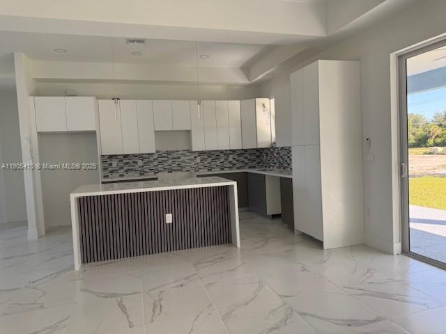 617 Valley Avenue Lehigh Acres, FL 33974 - Photo 12 of 46 a kitchen with a cabinets and a window
