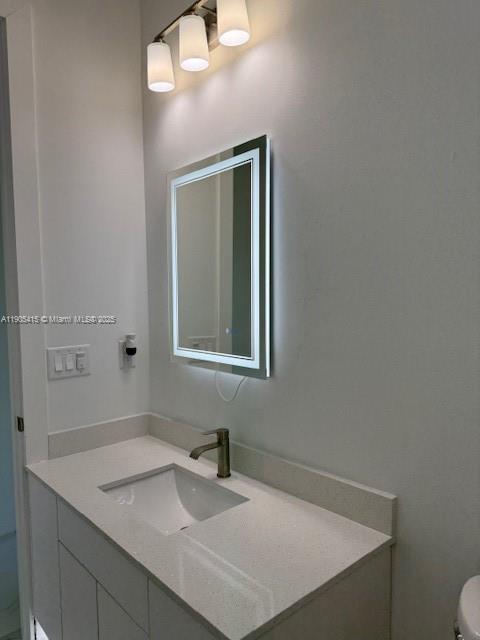 617 Valley Avenue Lehigh Acres, FL 33974 - Photo 23 of 46 a bathroom with a sink vanity and a mirror