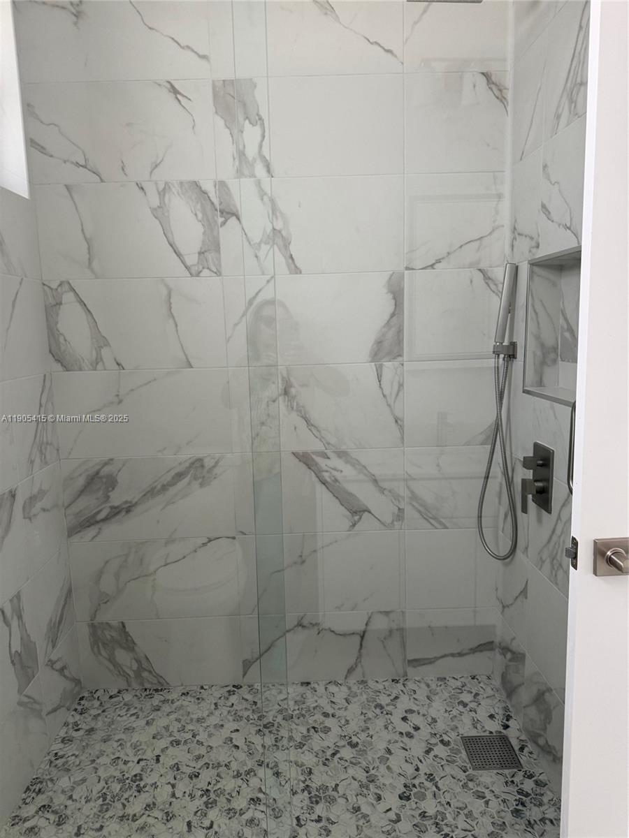 617 Valley Avenue Lehigh Acres, FL 33974 - Photo 28 of 46 a bathroom with a shower