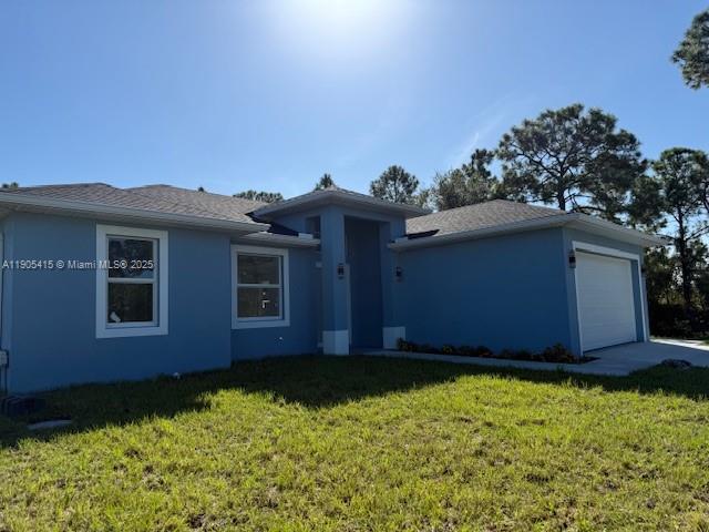 617 Valley Avenue Lehigh Acres, FL 33974 - Photo 3 of 46 a house with a yard