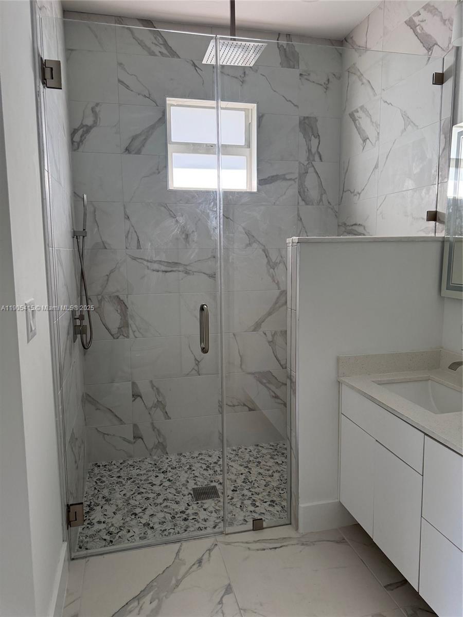 617 Valley Avenue Lehigh Acres, FL 33974 - Photo 31 of 46 a bathroom with a shower