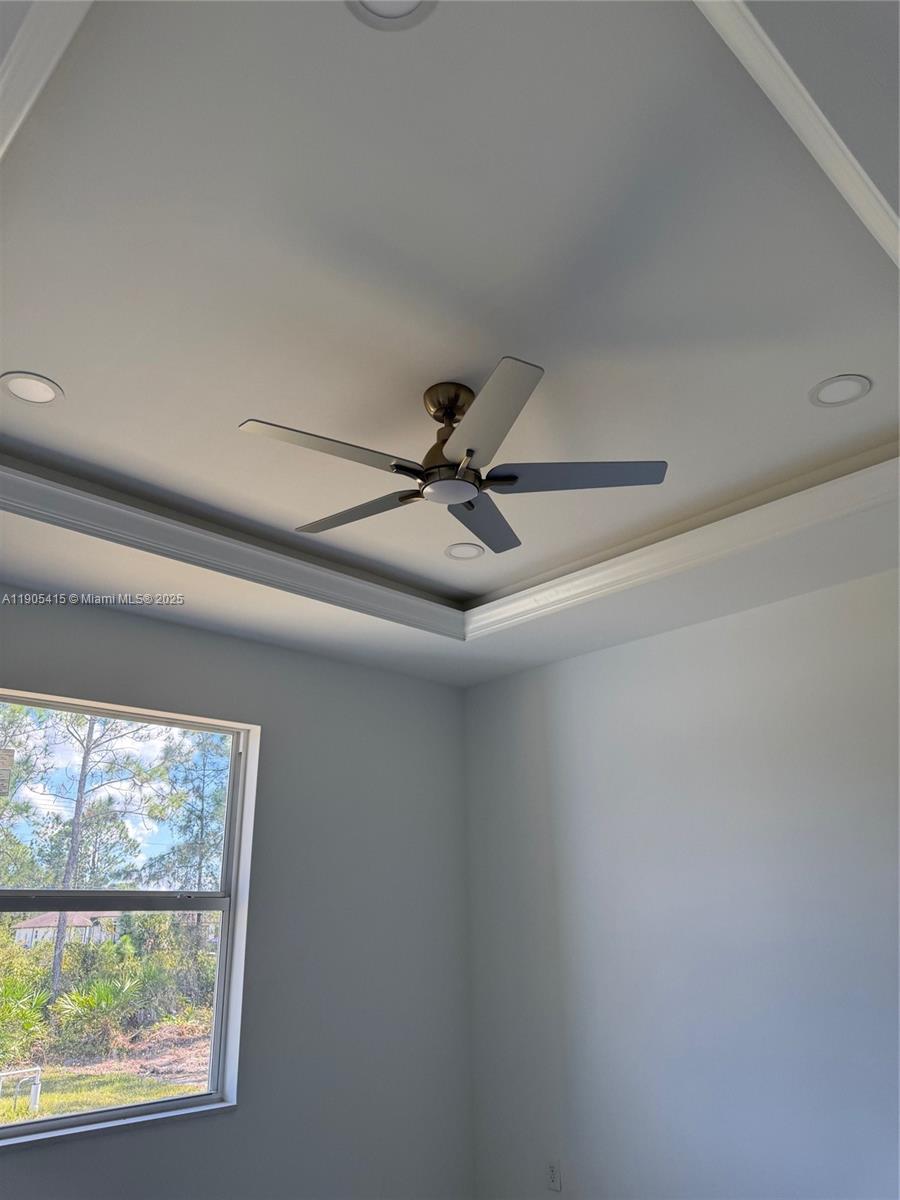 617 Valley Avenue Lehigh Acres, FL 33974 - Photo 33 of 46 a view of a room with a ceiling fan and window