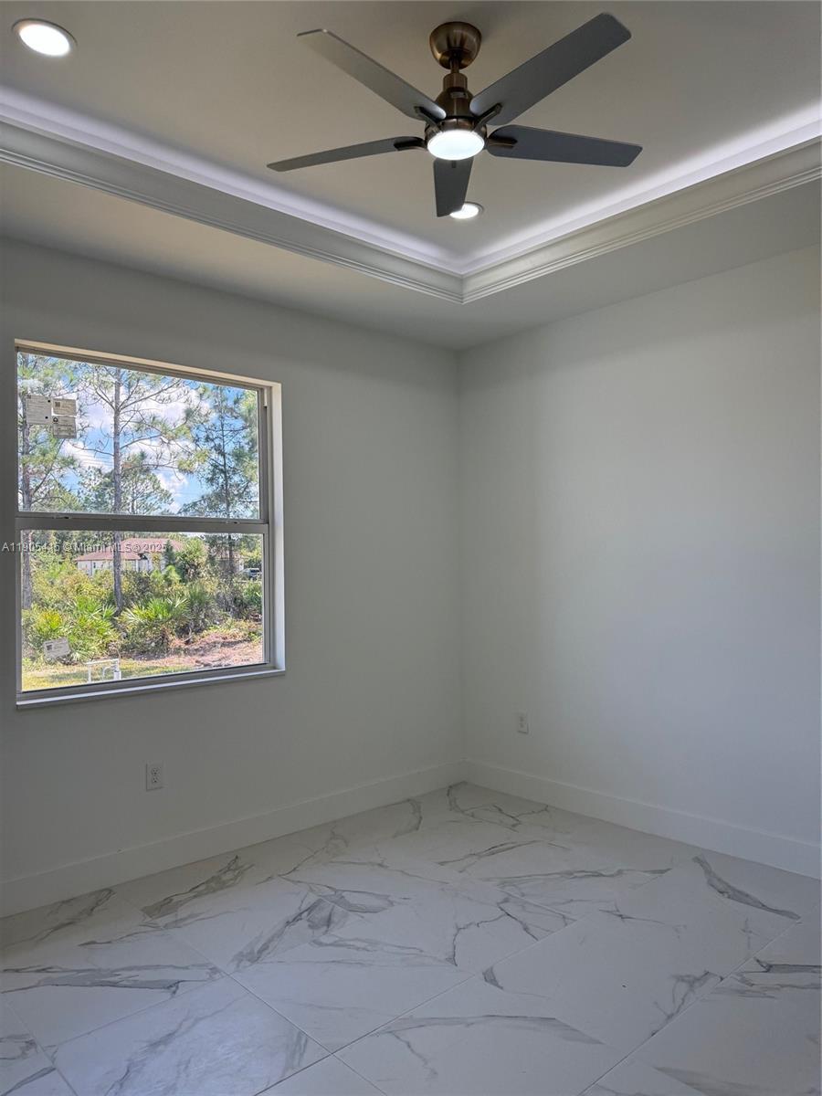 617 Valley Avenue Lehigh Acres, FL 33974 - Photo 34 of 46 an empty room with a window