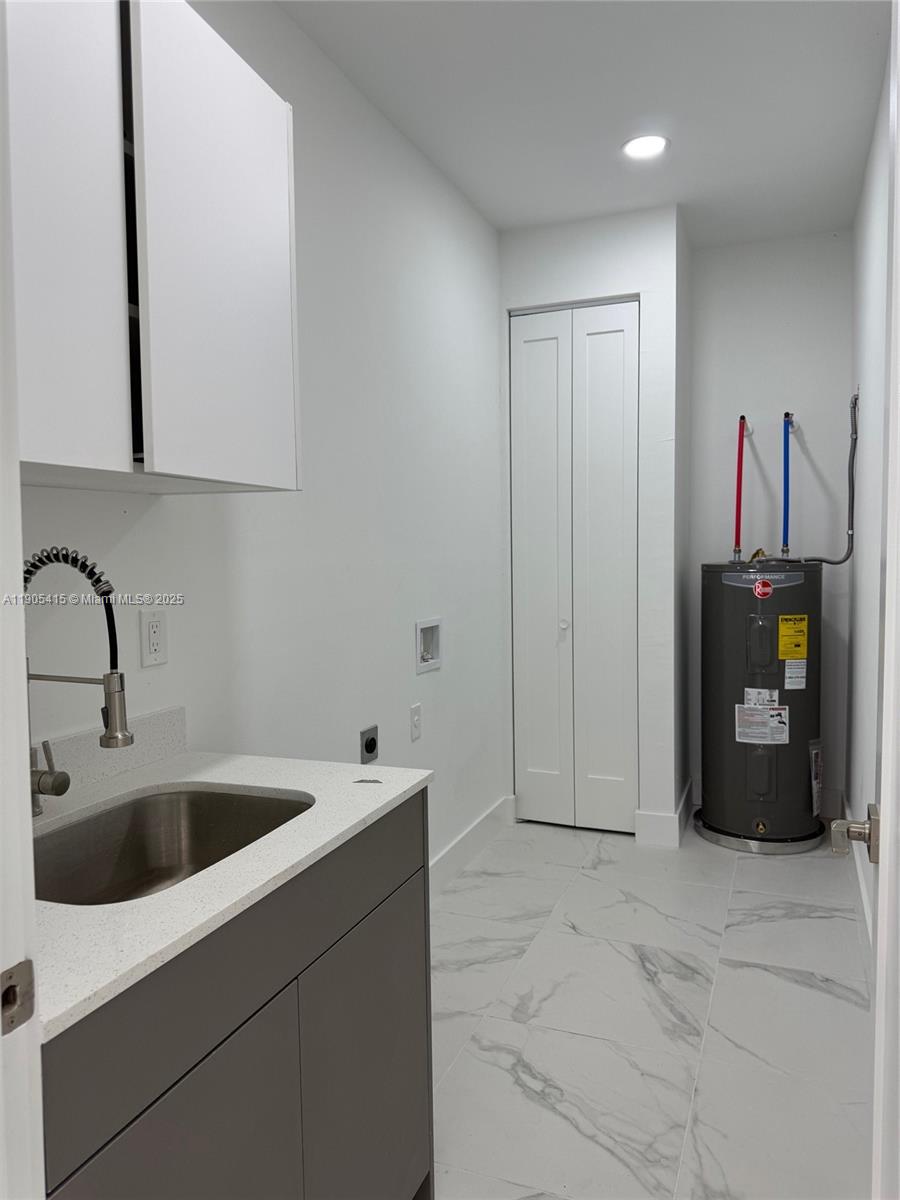 617 Valley Avenue Lehigh Acres, FL 33974 - Photo 41 of 46 a bathroom with a sink and a shower