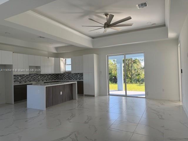 617 Valley Avenue Lehigh Acres, FL 33974 - Photo 5 of 46 a view of an empty room with a kitchen