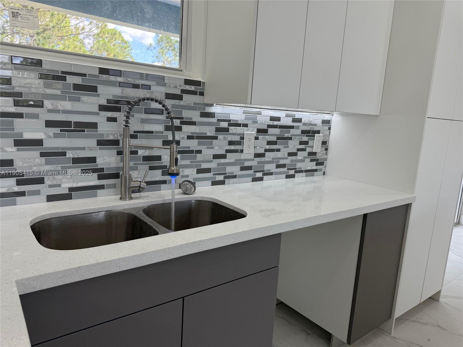 617 Valley Avenue Lehigh Acres, FL 33974 - Photo 8 of 46 a kitchen with a sink and cabinets