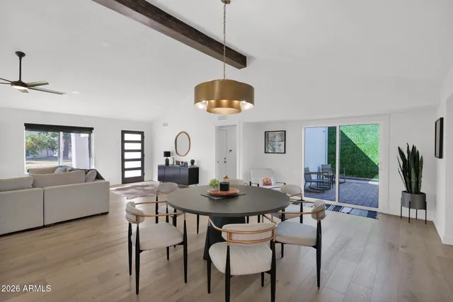 a dining room with furniture and window