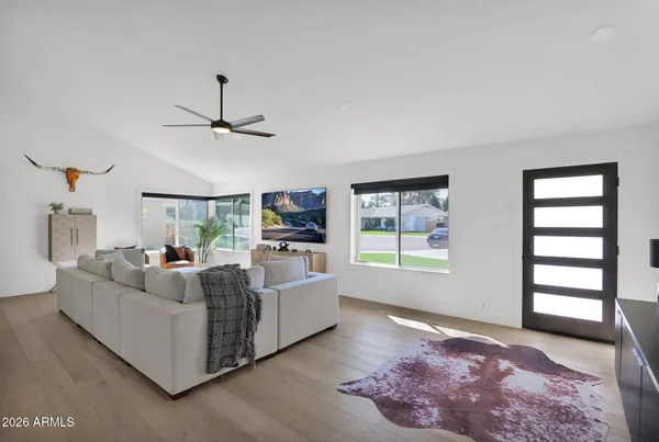 a living room with furniture and a window