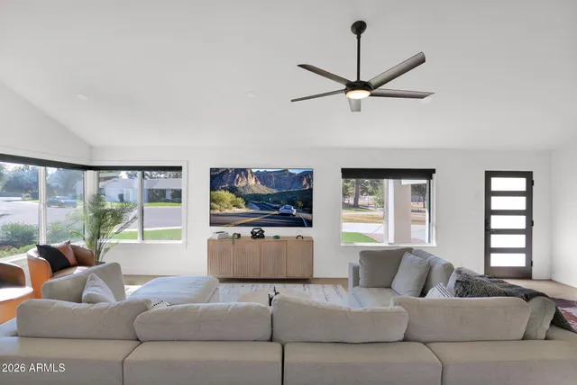 a living room with furniture and a large window