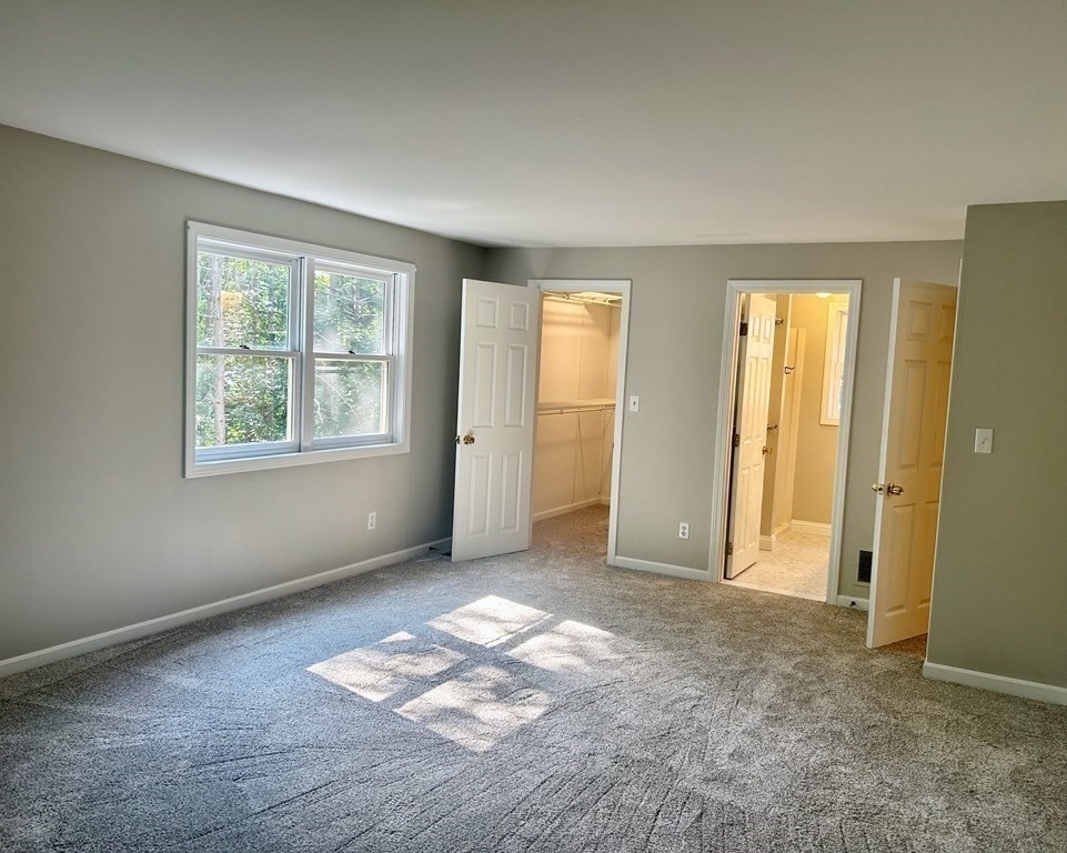 275 Burroughs Road Boxborough, MA 01719 - Photo 19 of 23 an empty room with windows and closet