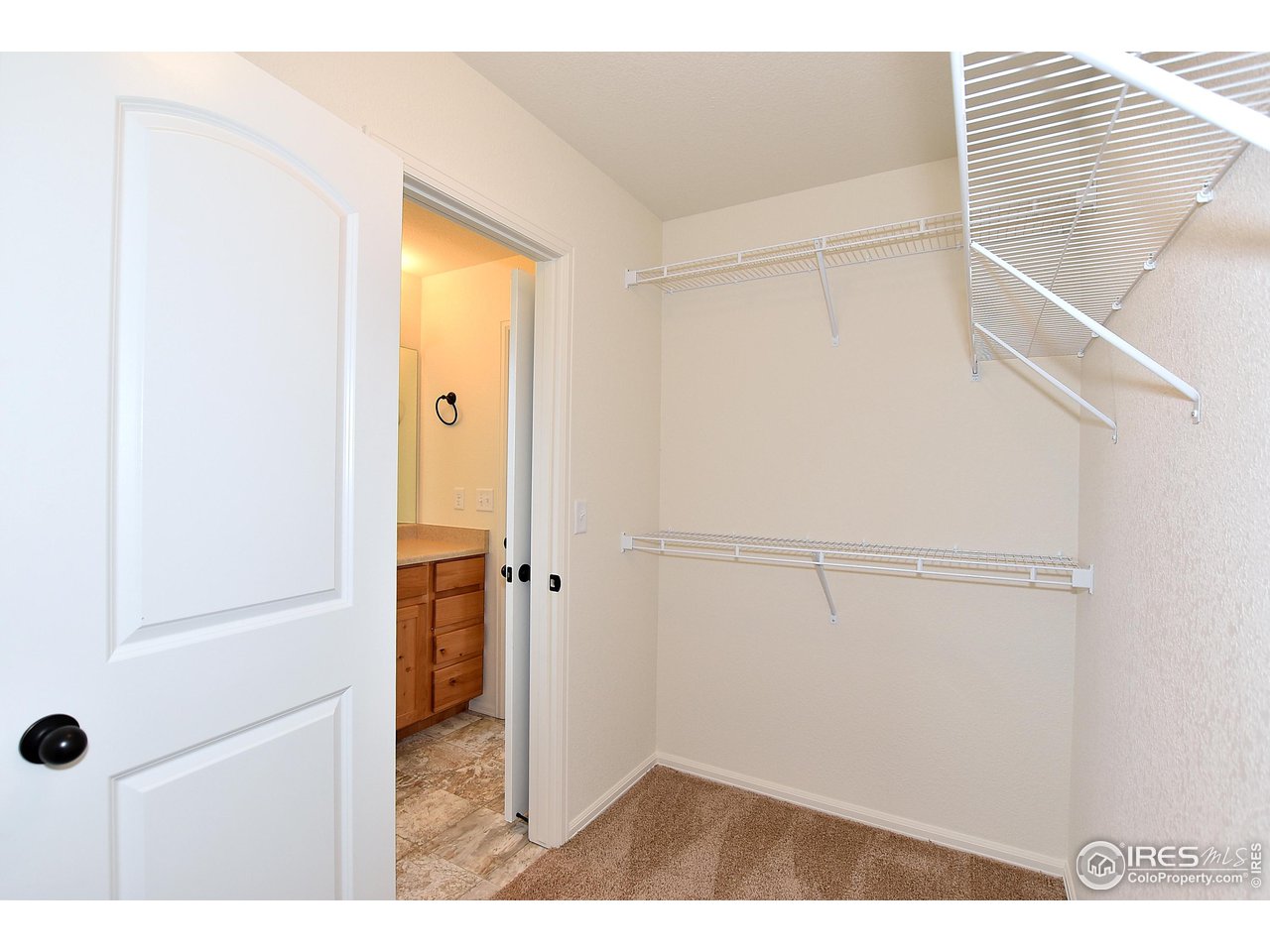 915 Milner Pass Road Severance, CO 80550 - Photo 25 of 37 a view of a bathroom with a glass shower door