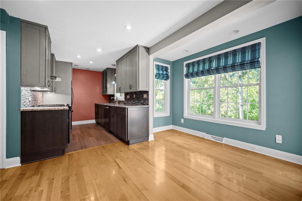 371 Highland Road Pittsburgh, PA 15235 - Photo 17 of 50 a kitchen with stainless steel appliances granite countertop a stove a sink and a refrigerator