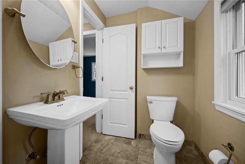 371 Highland Road Pittsburgh, PA 15235 - Photo 26 of 50 a bathroom with a toilet sink and mirror