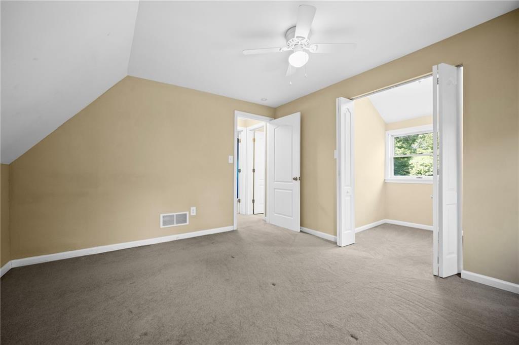371 Highland Road Pittsburgh, PA 15235 - Photo 31 of 50 an empty room with a ceiling fan and a window