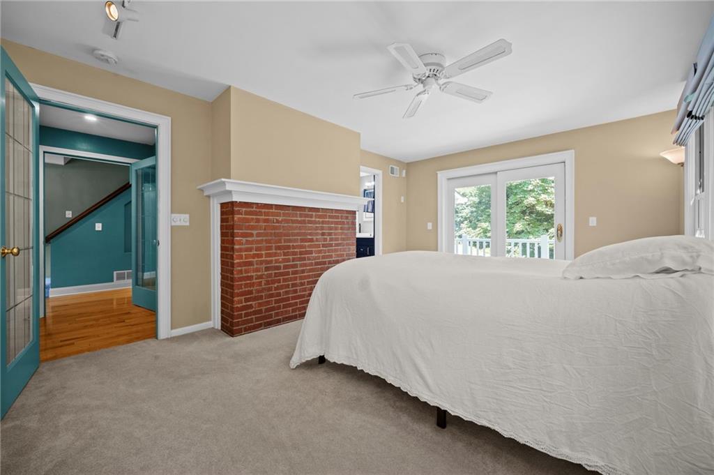 371 Highland Road Pittsburgh, PA 15235 - Photo 9 of 50 a bedroom with a bed and a ceiling fan