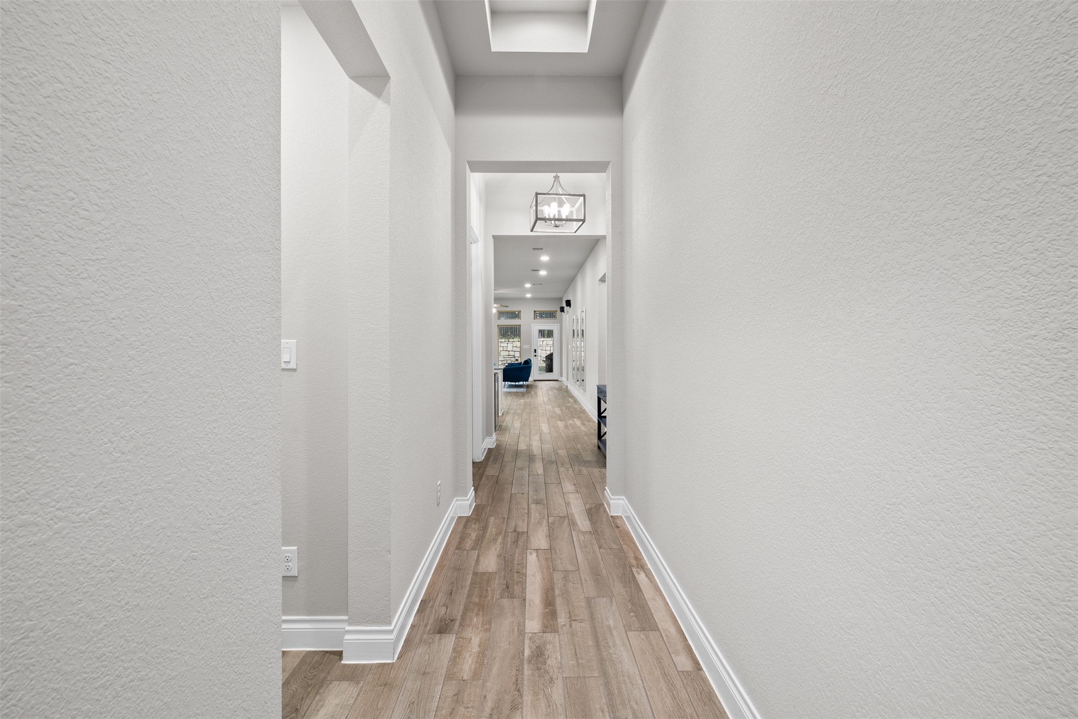 341 Pisa Lane Georgetown, TX 78628 - Photo 5 of 31 a view of a hallway with wooden floor and staircase