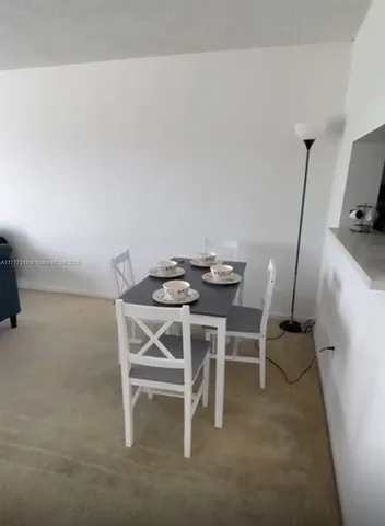 a dining room with furniture and a view