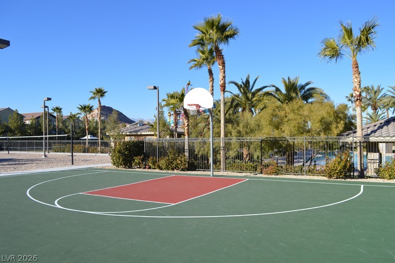 87 Tall Ruff Drive Las Vegas, NV 89148 - Photo 16 of 71 An outdoor basketball court offers a perfect setting for active recreation under clear skies.