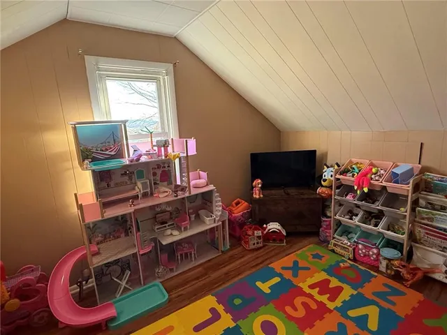 a room with furniture and a flat screen tv