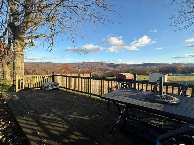 a view of a balcony with lake view and mountain view