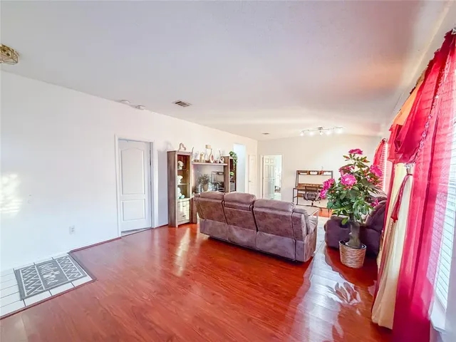 a bedroom with a bed and a desk