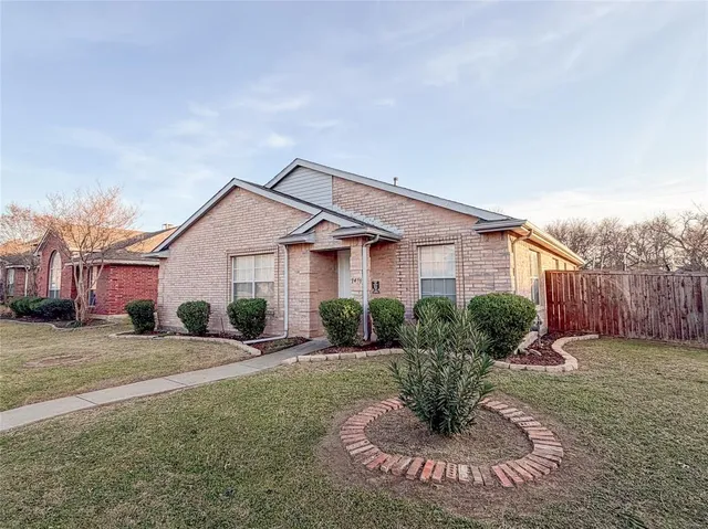 a kitchen with stainless steel appliances a refrigerator a sink a stove a microwave a dining table and chairs