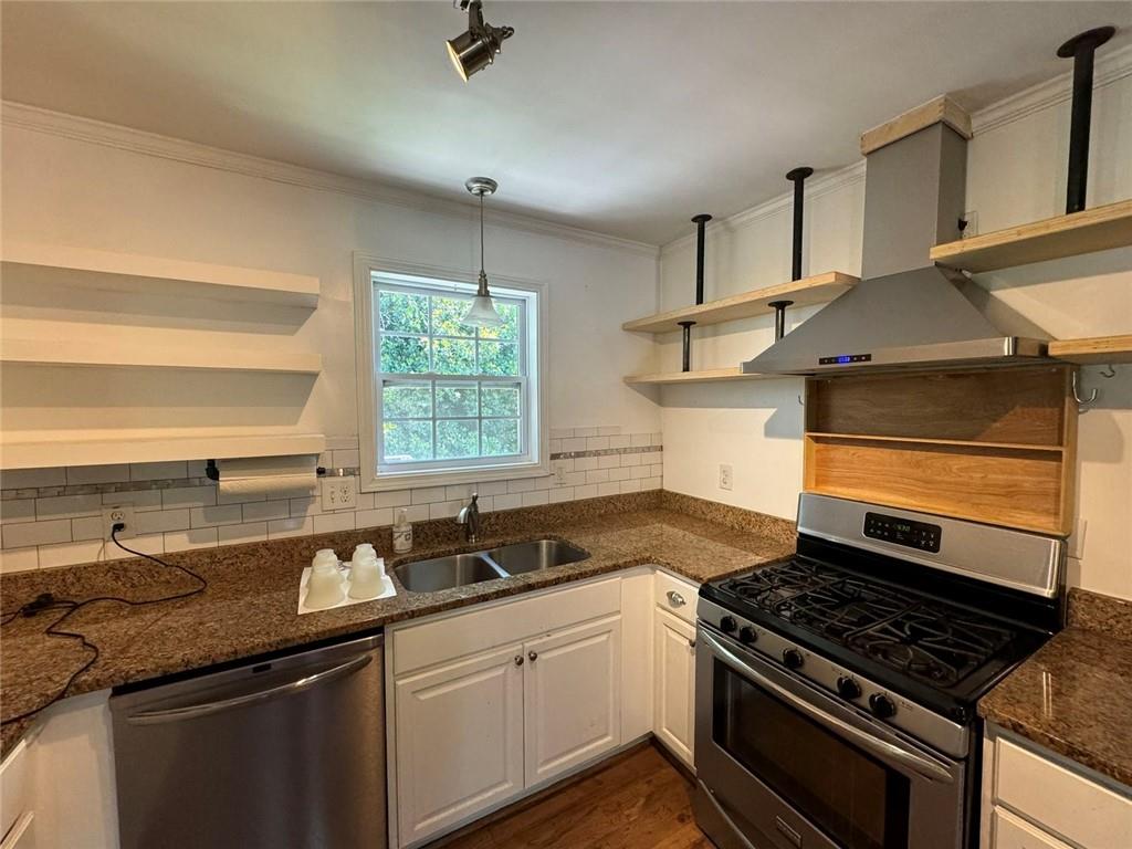 190 Cleveland Street Southeast Atlanta, GA 30316 - Photo 11 of 31 a kitchen with granite countertop a stove and a sink