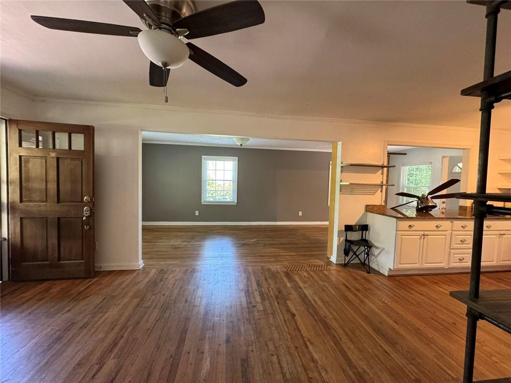 190 Cleveland Street Southeast Atlanta, GA 30316 - Photo 15 of 31 a view of a living room a kitchen and a wooden floor