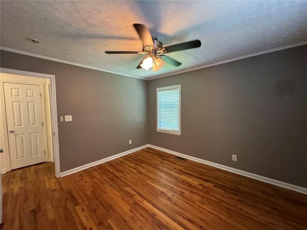 190 Cleveland Street Southeast Atlanta, GA 30316 - Photo 17 of 31 wooden floor in an empty room with a window