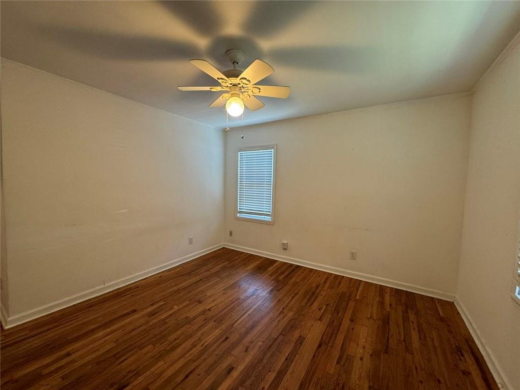 190 Cleveland Street Southeast Atlanta, GA 30316 - Photo 19 of 31 a view of an empty room with wooden floor and a window