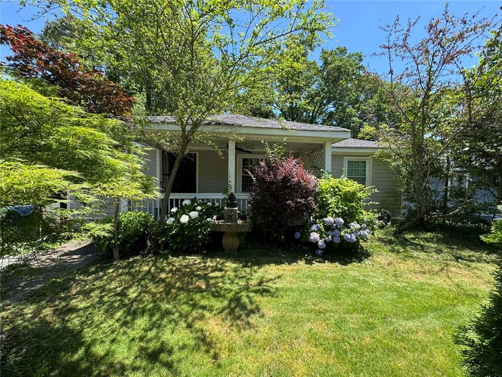190 Cleveland Street Southeast Atlanta, GA 30316 - Photo 28 of 31 a view of house with yard and a lot of flower plant in front of main door