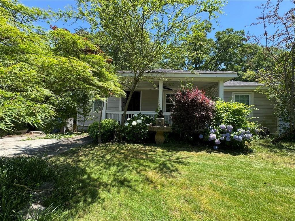 190 Cleveland Street Southeast Atlanta, GA 30316 - Photo 3 of 31 a view of a house with a yard and a garden