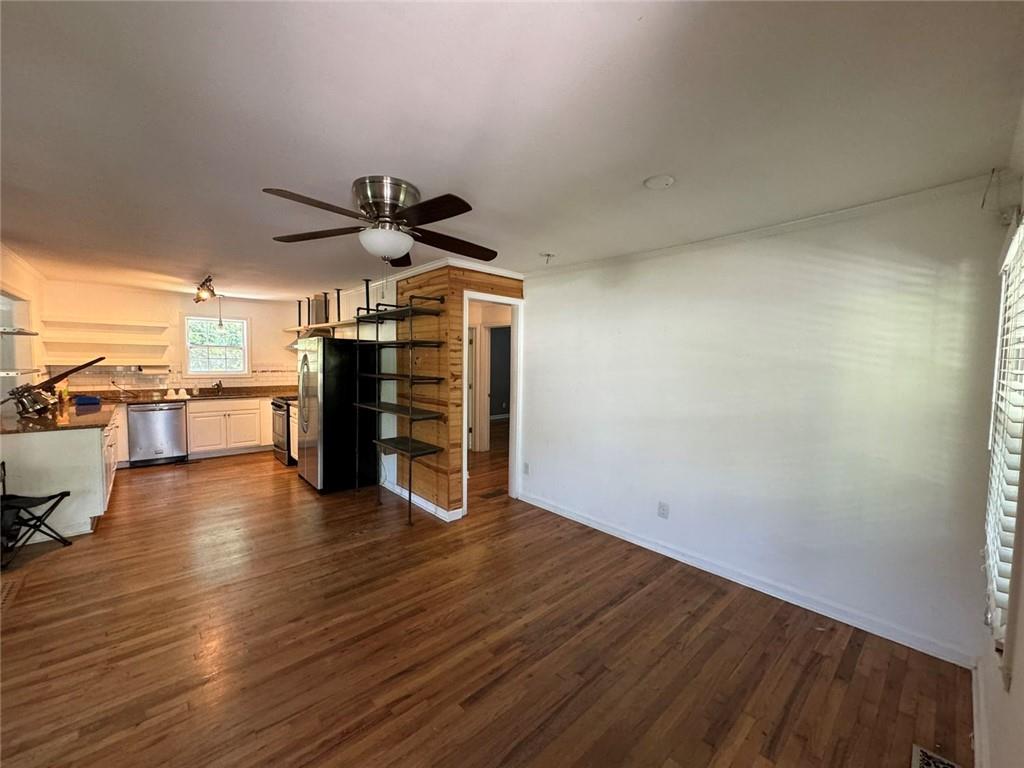 190 Cleveland Street Southeast Atlanta, GA 30316 - Photo 8 of 31 wooden floor in an empty room with a window