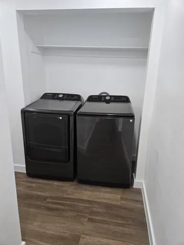 a living room with a bed and a mirror