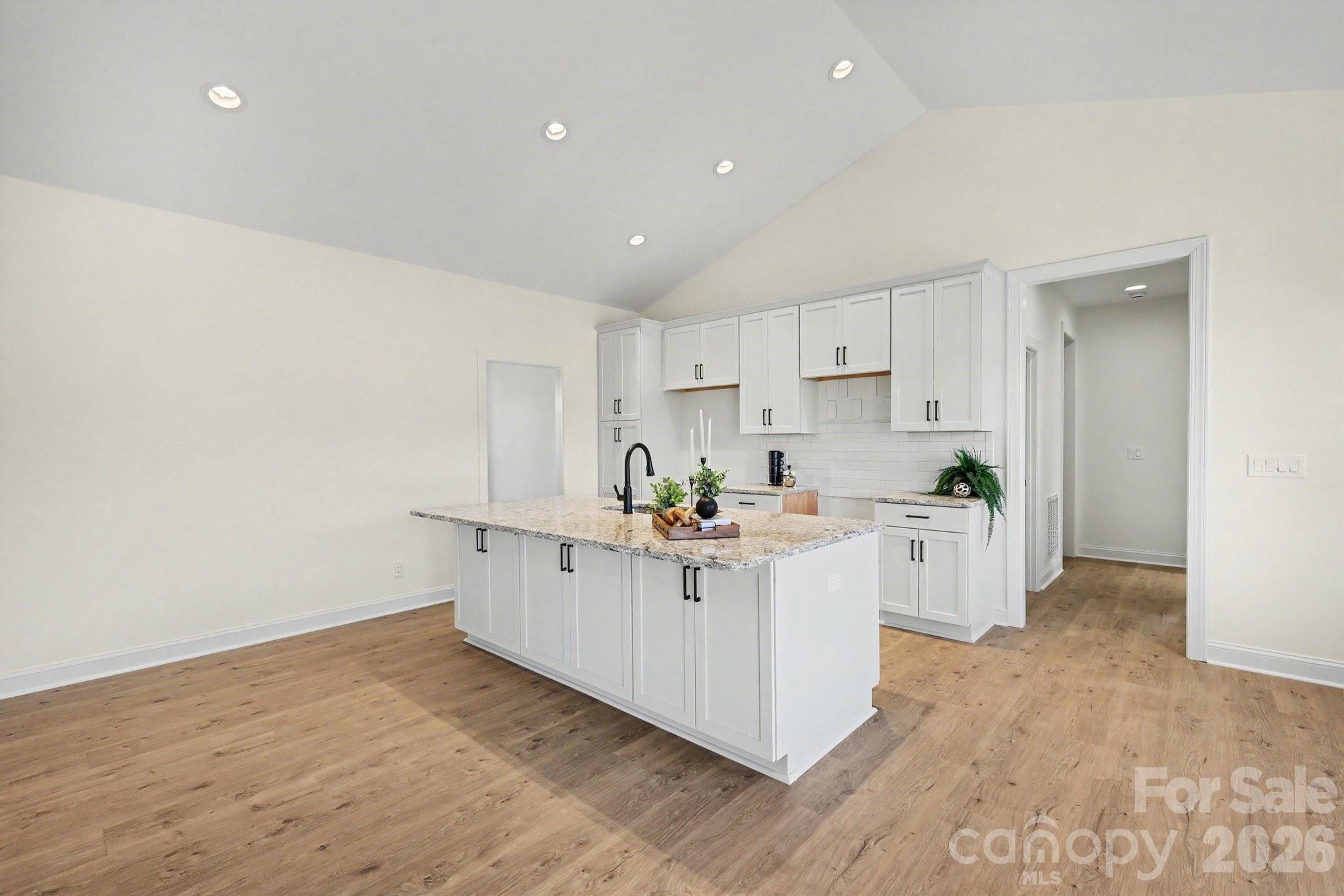 190 Goodnight Road Salisbury, NC 28147 - Photo 12 of 35 a kitchen with white cabinets and white appliances