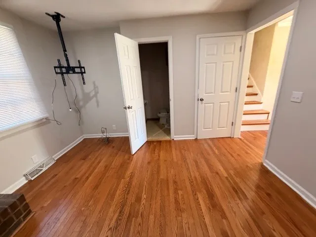a bathroom with double vanity sink and two mirror
