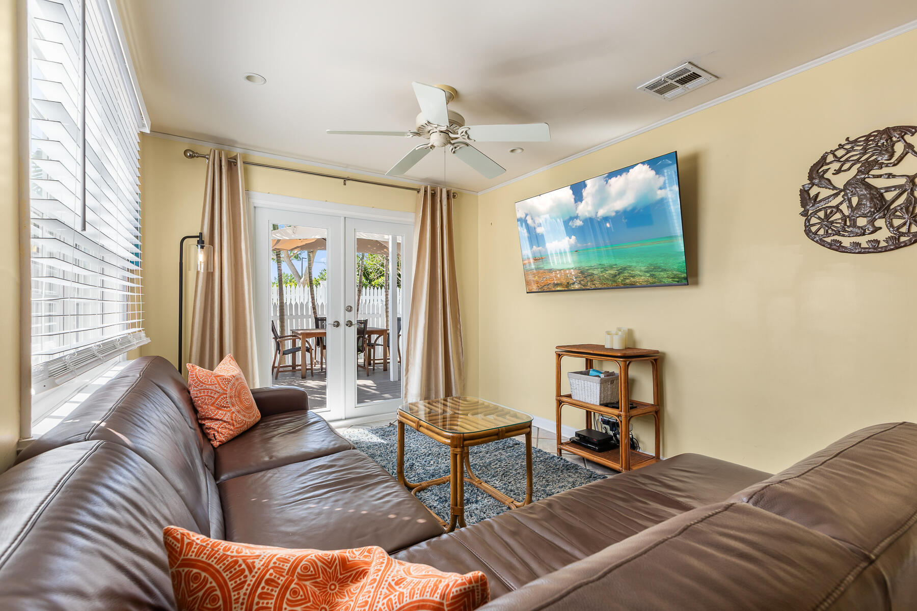 620 Thomas Street, Unit 175 Key West, FL 33040 - Photo 20 of 30 a living room with furniture and a flat screen tv