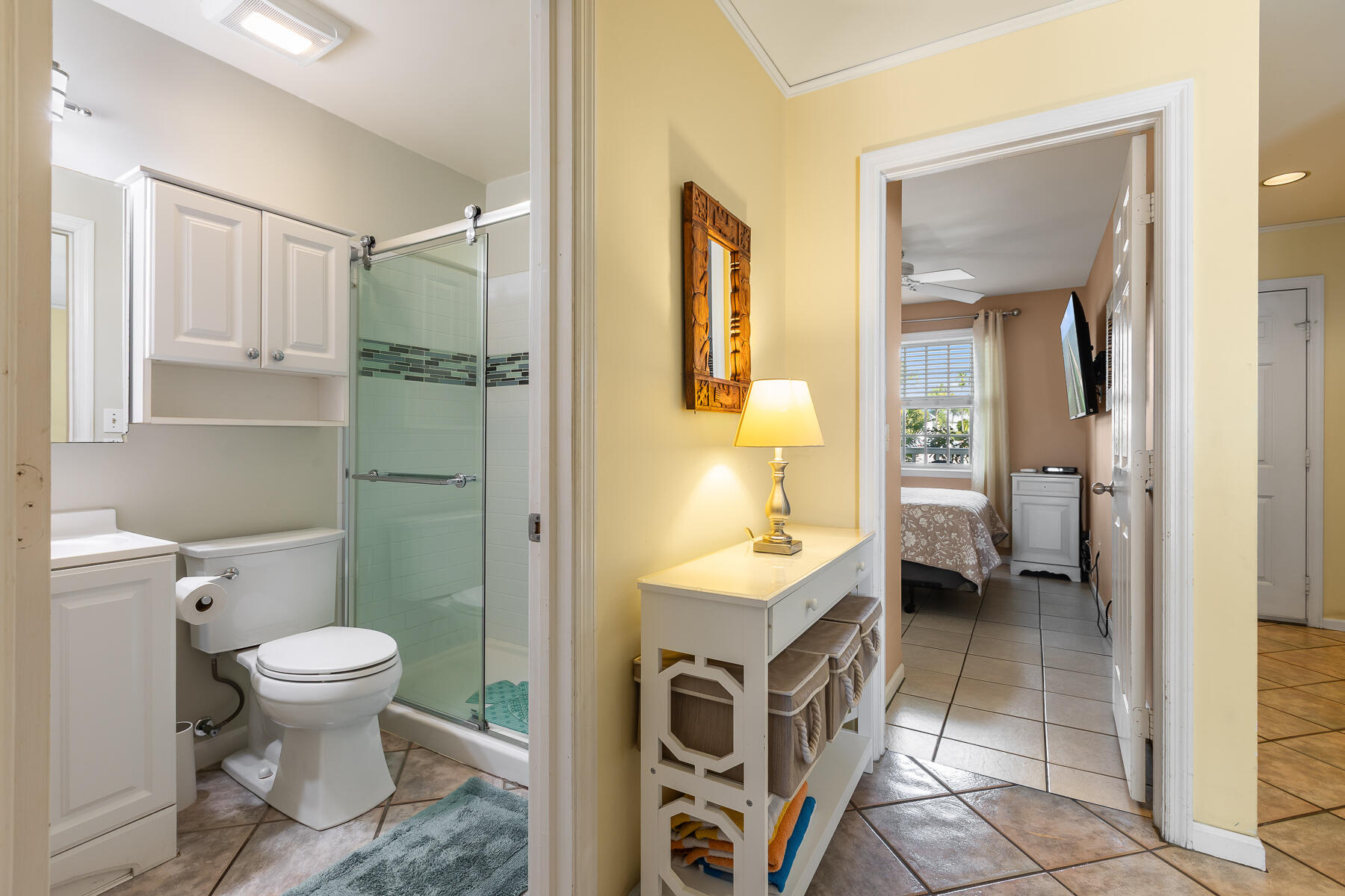 620 Thomas Street, Unit 175 Key West, FL 33040 - Photo 2 of 30 a bathroom with a sink a toilet and shower