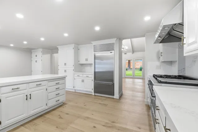 a bathroom with a shower sink and mirror